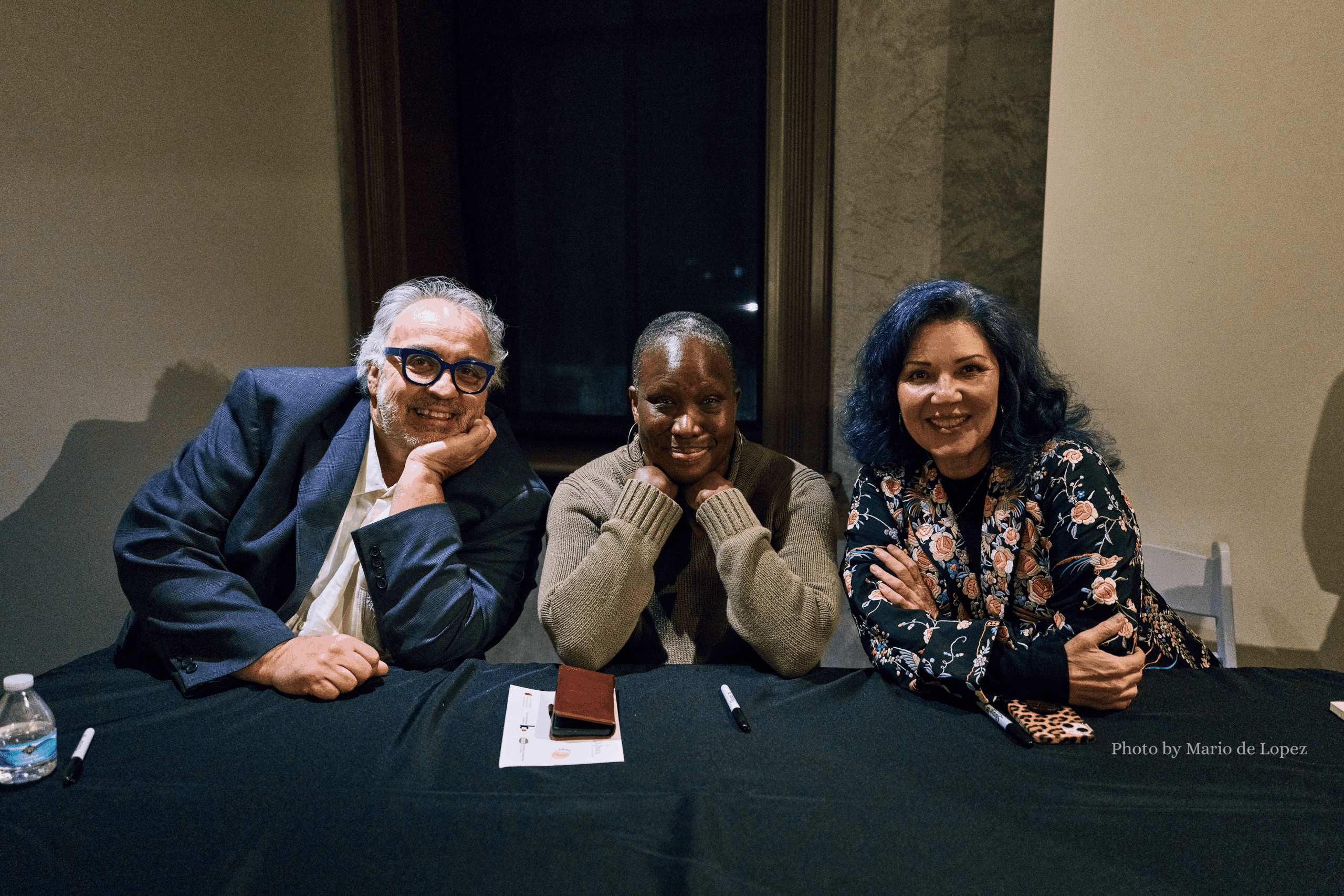 Three playwrights sitting down at a book signing