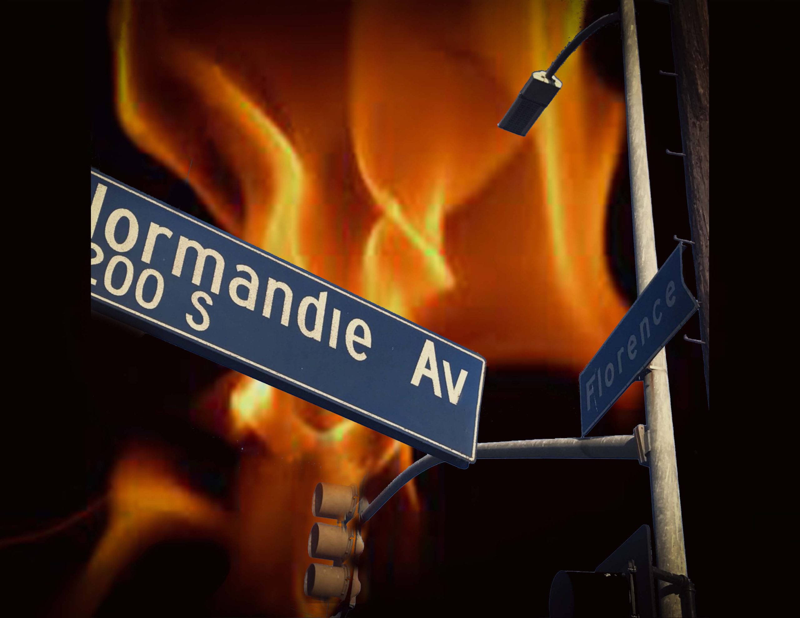 Picture of the intersection of Florence and Normandie with flames in the background