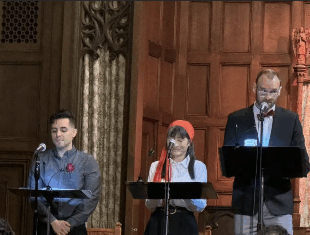 three actors reading onstage