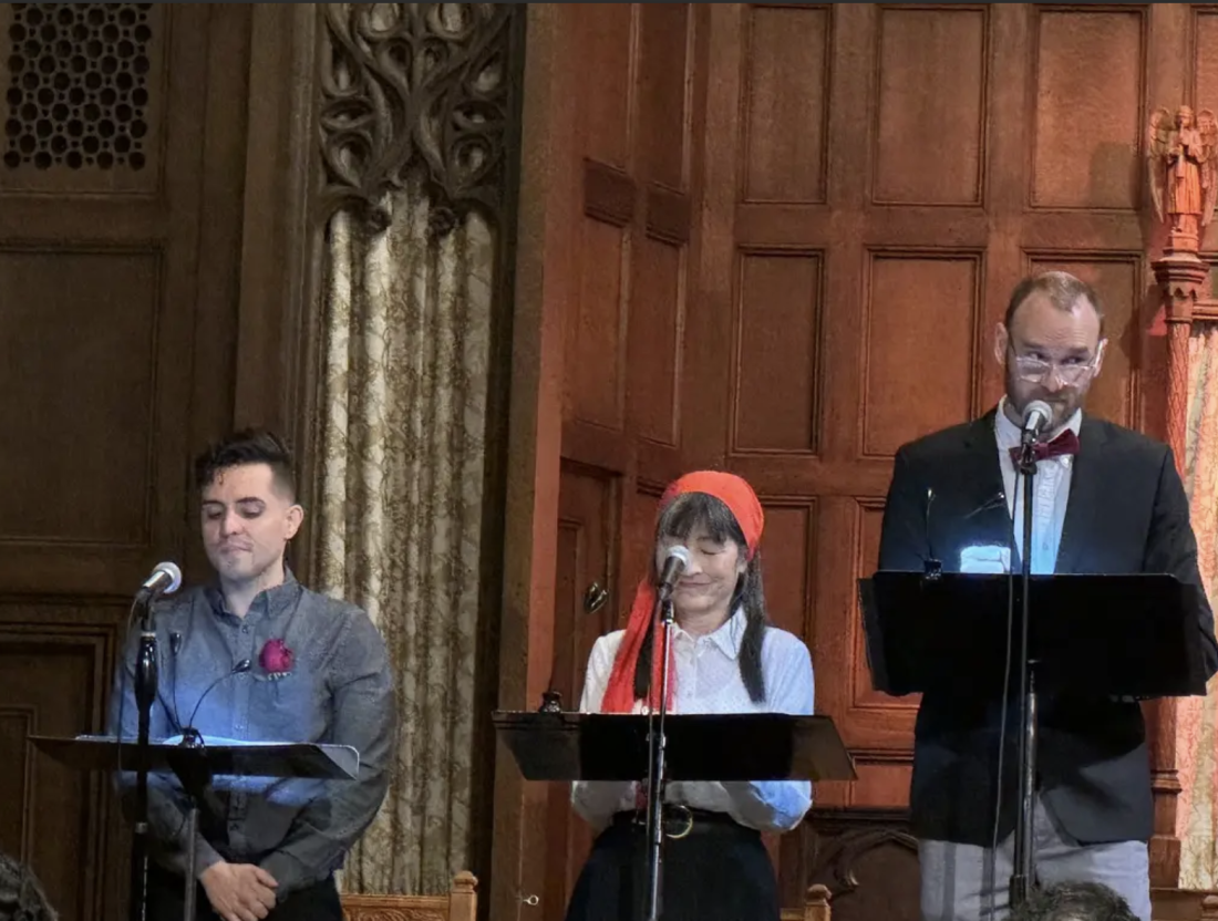 three actors reading onstage