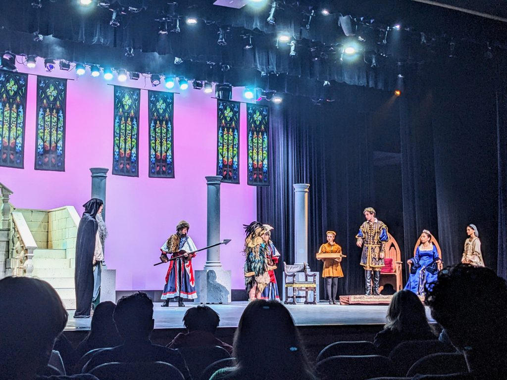 high school students performing a play onstage